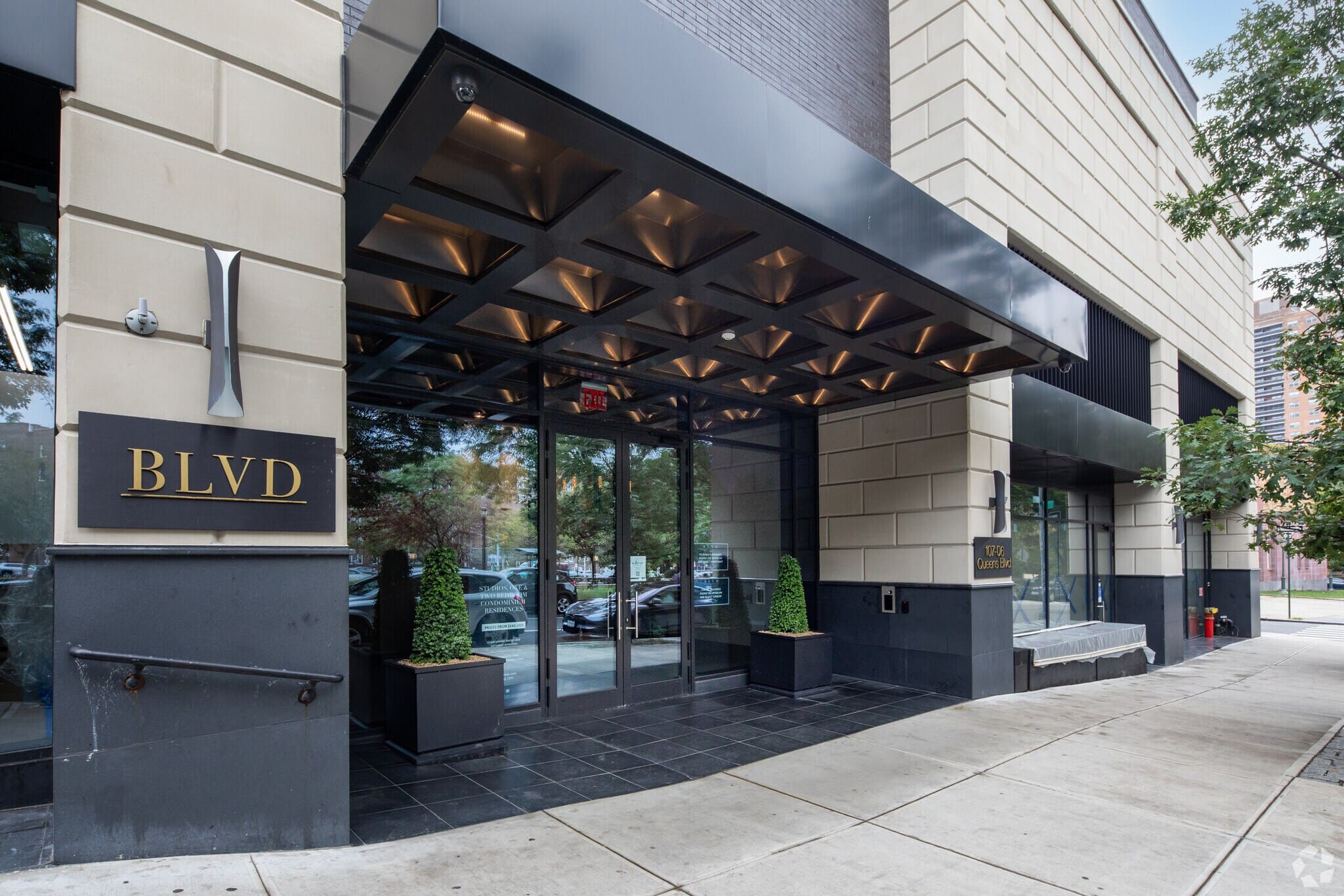 https://www.jarmelkizel.com/wp-content/uploads/2024/03/107-06-Queens-Blvd-Queens-NY-Entrance-4-LargeHighDefinition.jpg